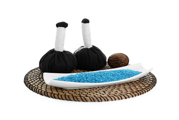 Wicker mat with blue sea salt and herbal bags isolated on white