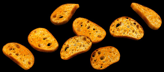 Bruschetta crackers, bread croutons on black background 