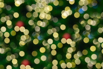 Blurred electric lights on Christmas tree decorate.