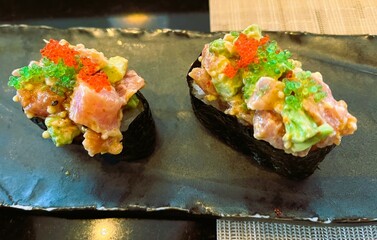 Gunkan maki sushi on the plate