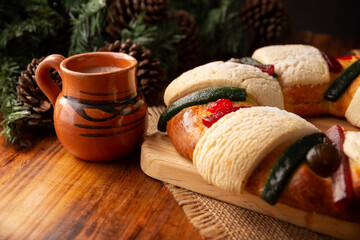 Three Kings Bread also called Rosca de Reyes, Roscon, Epiphany Cake, traditionally served with hot chocolate in a clay Jarrito. Mexican tradition on January 5th.