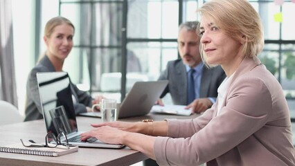 Portrait of creative business team using laptop, collage
