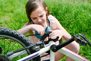 Fototapeta premium Young girl cyclist enjoy the beautiful sunrise on summer forest trail
