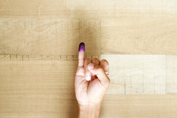 Man's little finger after voting on Indonesia's presidential election