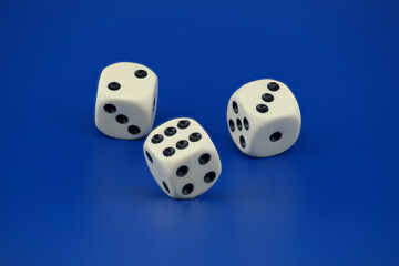 Gaming scene with three dice on blue background
