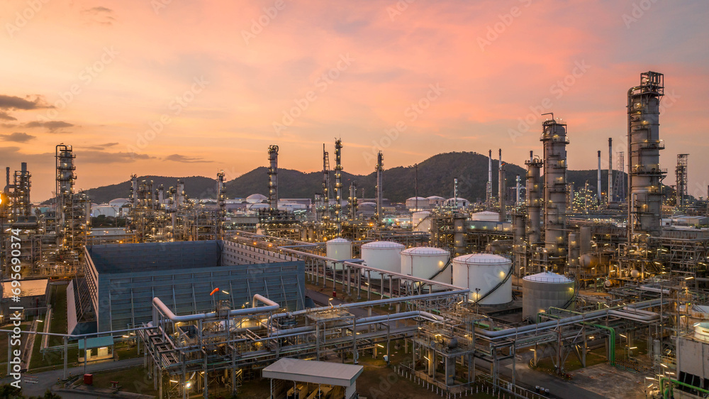 Canvas Prints Oil and gas industrial refinery at twilight, Oil refinery and Petrochemical plant pipeline steel, Refinery factory oil storage tank and pipeline steel at night.