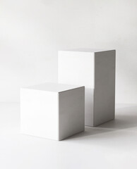 Two modern white cuboid podium, geometric pedestal on counter in sunlight. Luxury cosmetic, skincare, beauty, body, hair care, treatment, fashion product display background 3D
