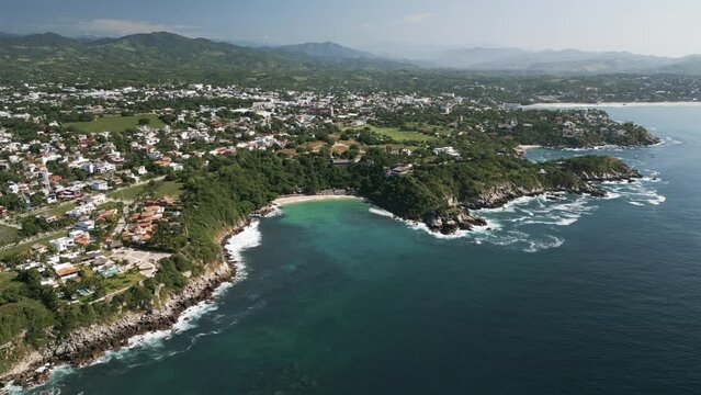 Aerial hing angle of Puerto Escondido Oaxaca coastline travel holiday surf destination in Mexico