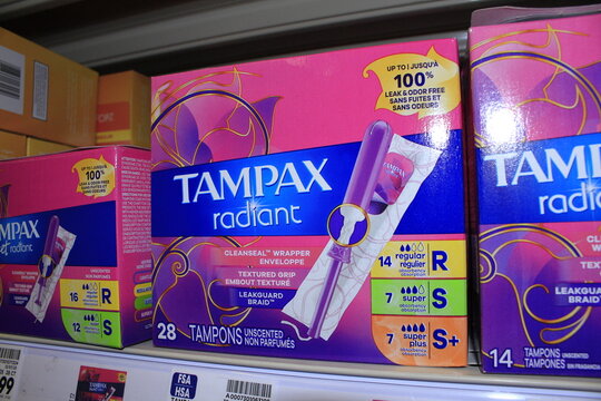 TAMPAX Tampons in packages on a shelf