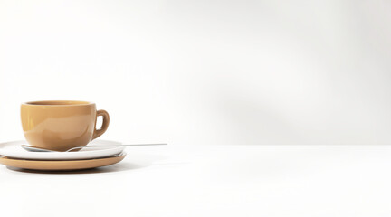 Brown coffee cup and teaspoon on white saucer on table counter in morning sunlight, leaf shadow for food, drink, afternoon tea product display background 3D