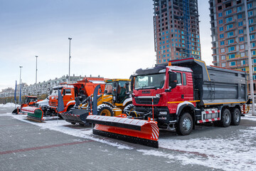 Snow removal machines at an industrial exhibition in winter