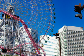 A ferris wheel near the urban city in Yokohama telephoto shot