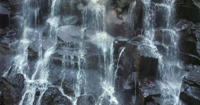Kanto Lampo waterfall in lush tropical forest, Bali, Indonesia