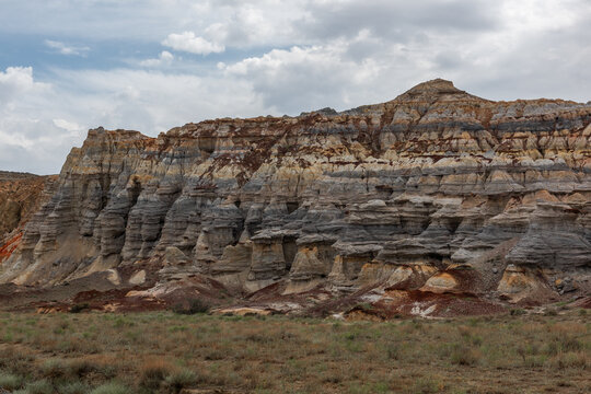 A picturesque canyon made of compressed clay, stones and sand in the South-East of Kazakhstan in the vicinity of the city of Aktau on a cloudy day