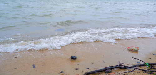 A Natural View Of The Foamy Sea Waves Breaking On The Shore Of Tanjung Kalian, Indonesia