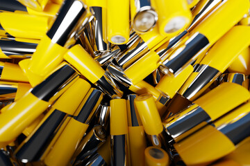 3D illustration of a close-up of  yellow batteries on a dark background. An unsafe way to use energy.