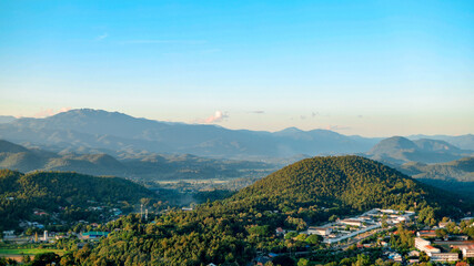The city view of Mae Hong Son with mountains surrounding it is a beautiful landscape.