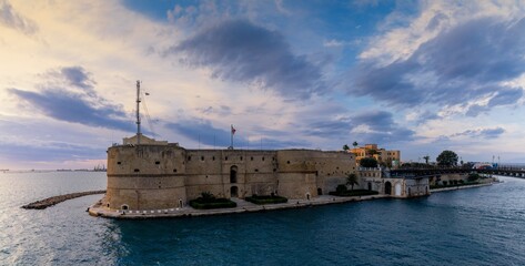 view of the Castello Aragonese fortress in the harbor of Taranto in Apulia