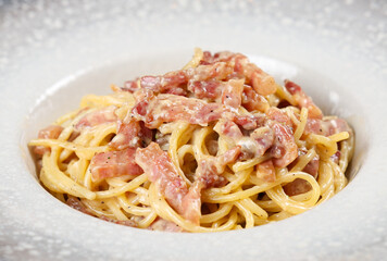 Spaghetti Carbonara. Close up photo of a tasty dish made from spaghetti carbonara, a traditional pasta plate from Italy.