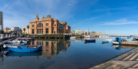 view of the historic Teatro Margherita building and fishermen harbour in Bari Vecchio - obrazy, fototapety, plakaty