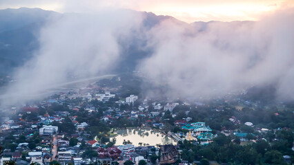 View of Mae Hong Son Province, Thailand in the morning with fog hanging over Mueang District.