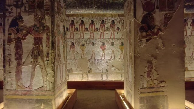 Luxor, Egypt: Point of view of a tourist who walks into the interior of the famous Seti the first tomb in the valley of Kings in Luxor in Egypt. 