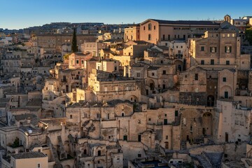 Fototapeta na wymiar view of the old city center of Matera with the stone houses in the last rays of sunlight