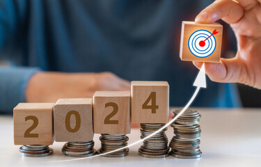 Human with 2024 new year target sale profit and arrow business financial investment graph, business...