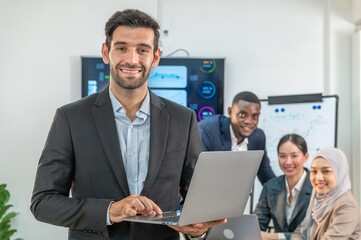 businessman leader supervisor and manager smile and carry hold notebook tablet in office company. leader senior manager looking and carry laptop in meeting room multiracial teamwork background.