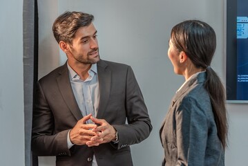 Asian muslim woman assistant secretary discussion examining in inspection check data in tablet notebook with boss manager. Boss and muslim woman partnership talking check successful data in laptop.