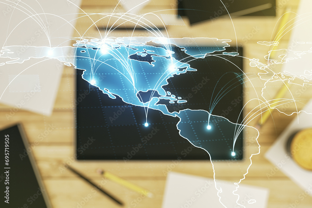 Wall mural double exposure of abstract digital world map with connections and modern digital tablet on backgrou