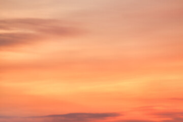 A beautiful sky tinted by the sun leaving vibrant shades of gold, pink, blue and multicolored. Clouds in the twilight evening and morning sky. Image of a cloudy sky in the evening and during the day