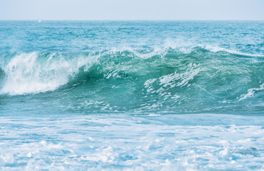 Wave splashing close-up. Crystal clear sea water, in the ocean in San Francisco Bay, blue water, pastel colors.