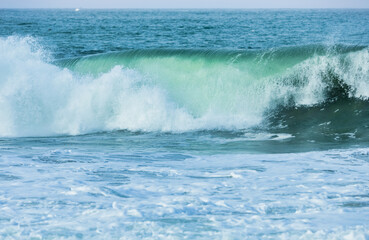 Wave splashing close-up. Crystal clear sea water, in the ocean in San Francisco Bay, blue water, pastel colors.