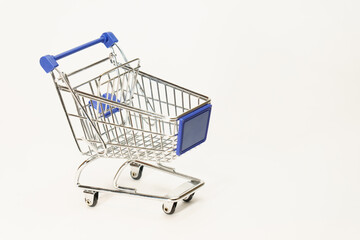 metal shopping cart with wheels, empty, isolated on white background