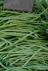 Fresh green beans are sold at the market. fresh vegetables in basket. with the concept of vegetables sold in traditional markets.