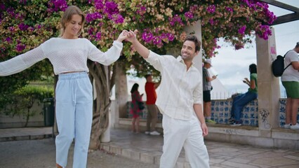 Dating pair strolling greenery city date. Love man woman holding hands at park