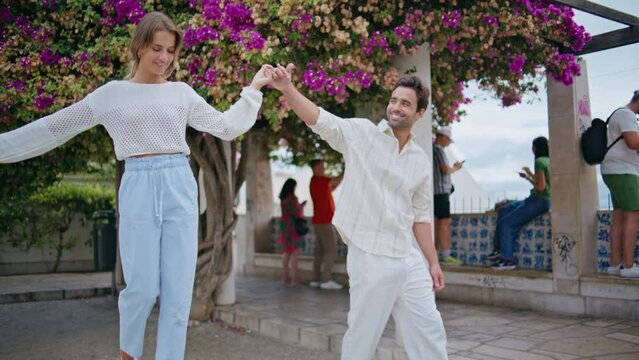 Dating pair strolling greenery city date. Love man woman holding hands at park