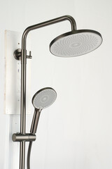 The sleek grey shower tower adds a modern touch to your bathroom. With multiple shower functions, it offers a customizable experience.