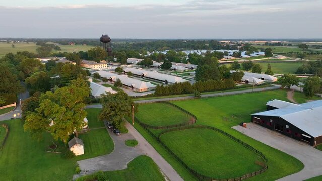 Horse farm in Kentucky during summer. Aerial view of barns and equestrian farm in USA.