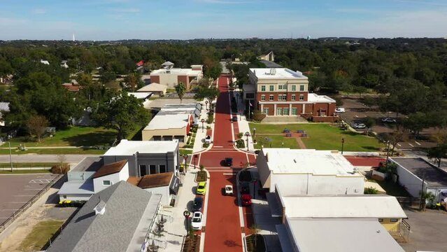 Bird's eye view above cars driving along historic downtown Clermont Florida main street