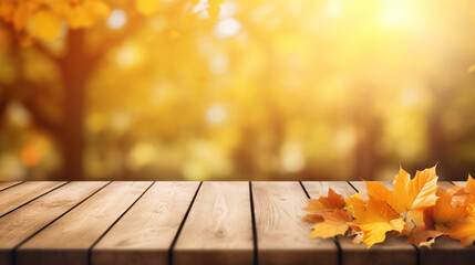 Naklejka na ściany i meble Yellow and orange autumn leaves on wooden surface