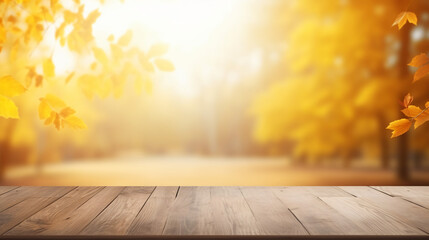 Naklejka na ściany i meble Yellow and orange autumn leaves on wooden surface