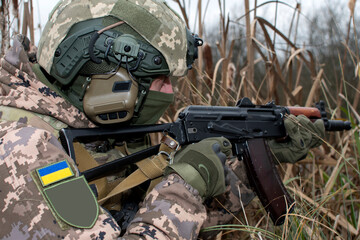 Ukrainian soldier with a machine gun