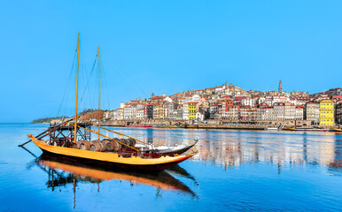 Portugal - Porto old town panoramic view at riverfront  - Rabelo boat sightseeing in Douro river, Oporto.
