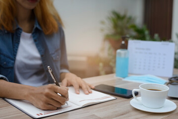 Planner plan Schedule Calendar and reminder agenda, work online at home. Woman hand planning daily...