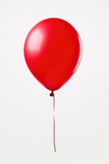 A red balloon floating in the air. This image can be used for various purposes