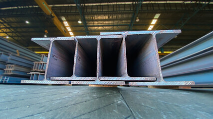 Metal forming steel beams at the metal products warehouse, H-beam steel and Wi-Frank steel. For...