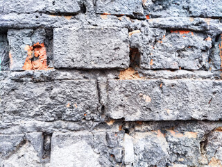 Background and texture with gray old brick and plaster remnants. Abstract background, texture,...