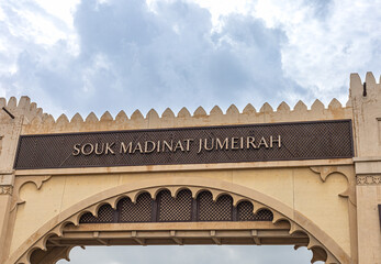 Signboard of Souk Madinat Jumeira in Dubai. Good-for-walk bazaar. authentic re-creation of an ancient marketplace - obrazy, fototapety, plakaty